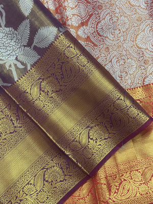 Model draped in a shimmering Tissue Banarasi Silk Saree with zari border, ideal for wedding and festive celebrations.