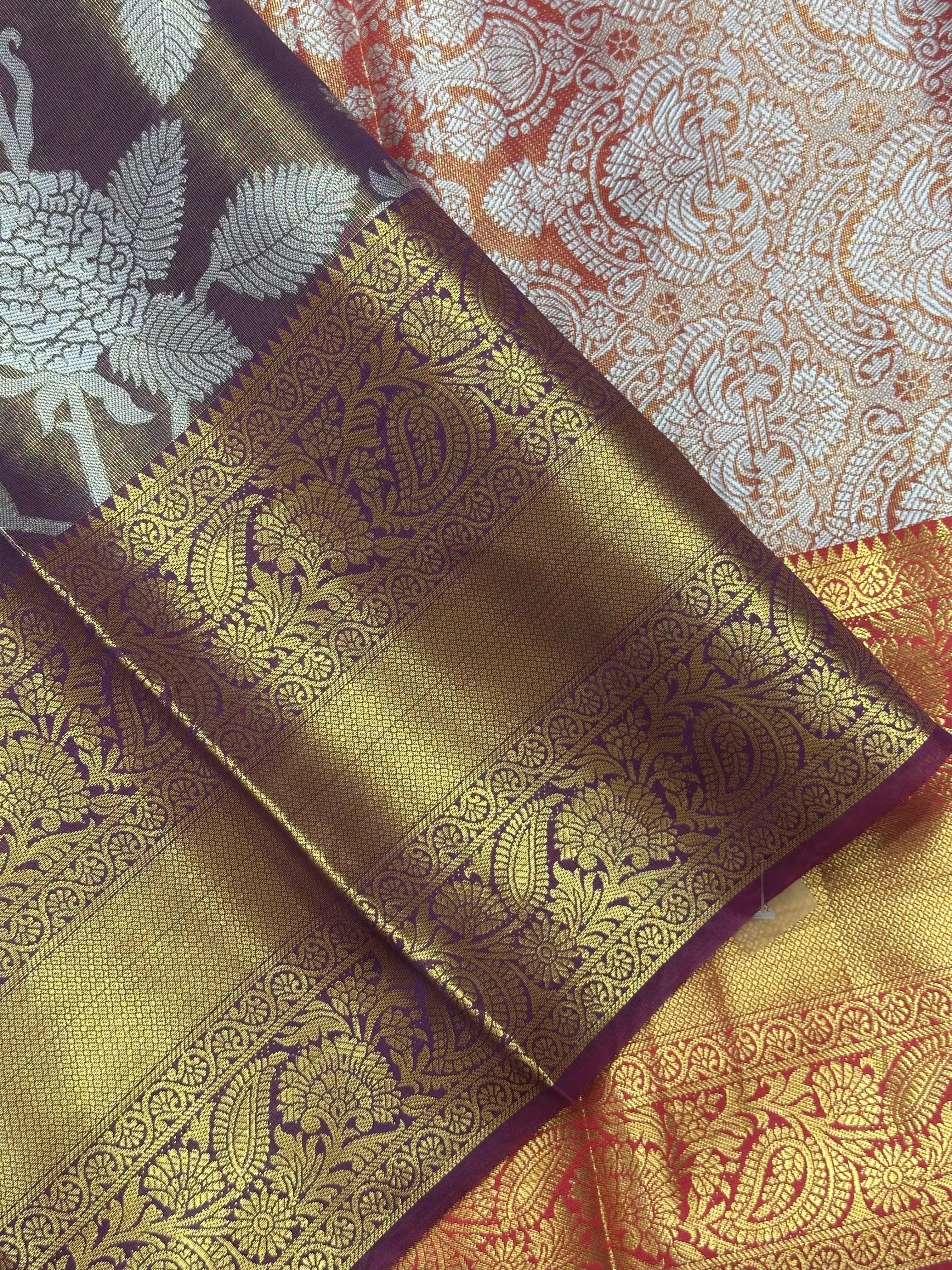 Model draped in a shimmering Tissue Banarasi Silk Saree with zari border, ideal for wedding and festive celebrations.