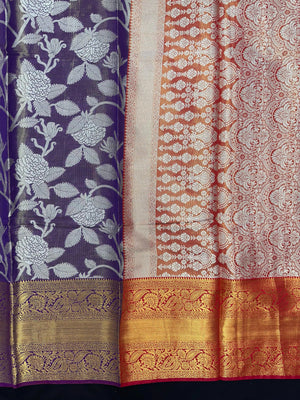 Model draped in a shimmering Tissue Banarasi Silk Saree with zari border, ideal for wedding and festive celebrations.
