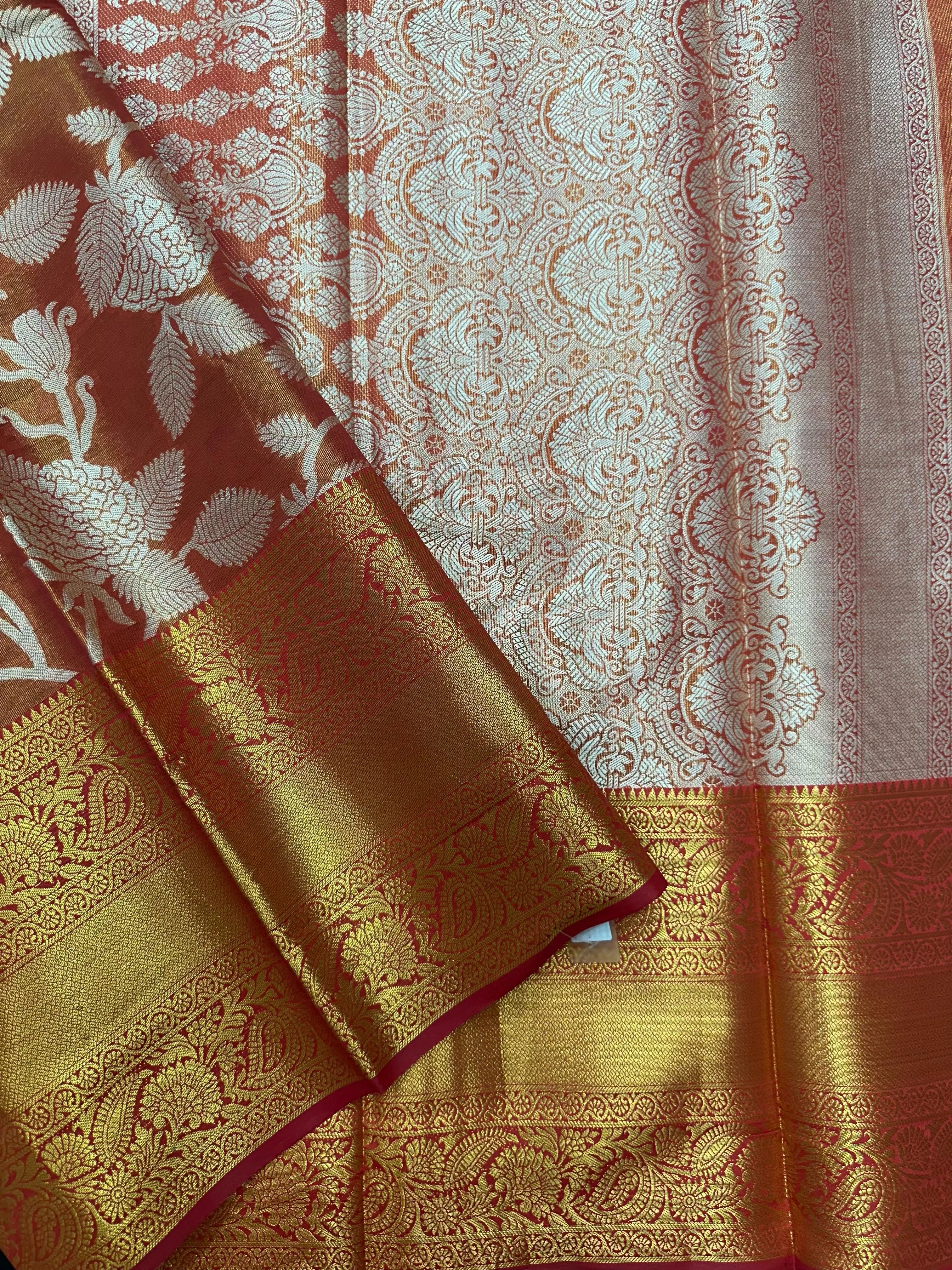 Model draped in a shimmering Tissue Banarasi Silk Saree with zari border, ideal for wedding and festive celebrations.