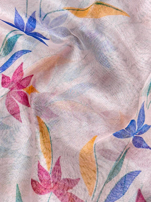 Woman in a shimmering Tissue Silk Saree with soft gold sheen, perfect for weddings and festive events.