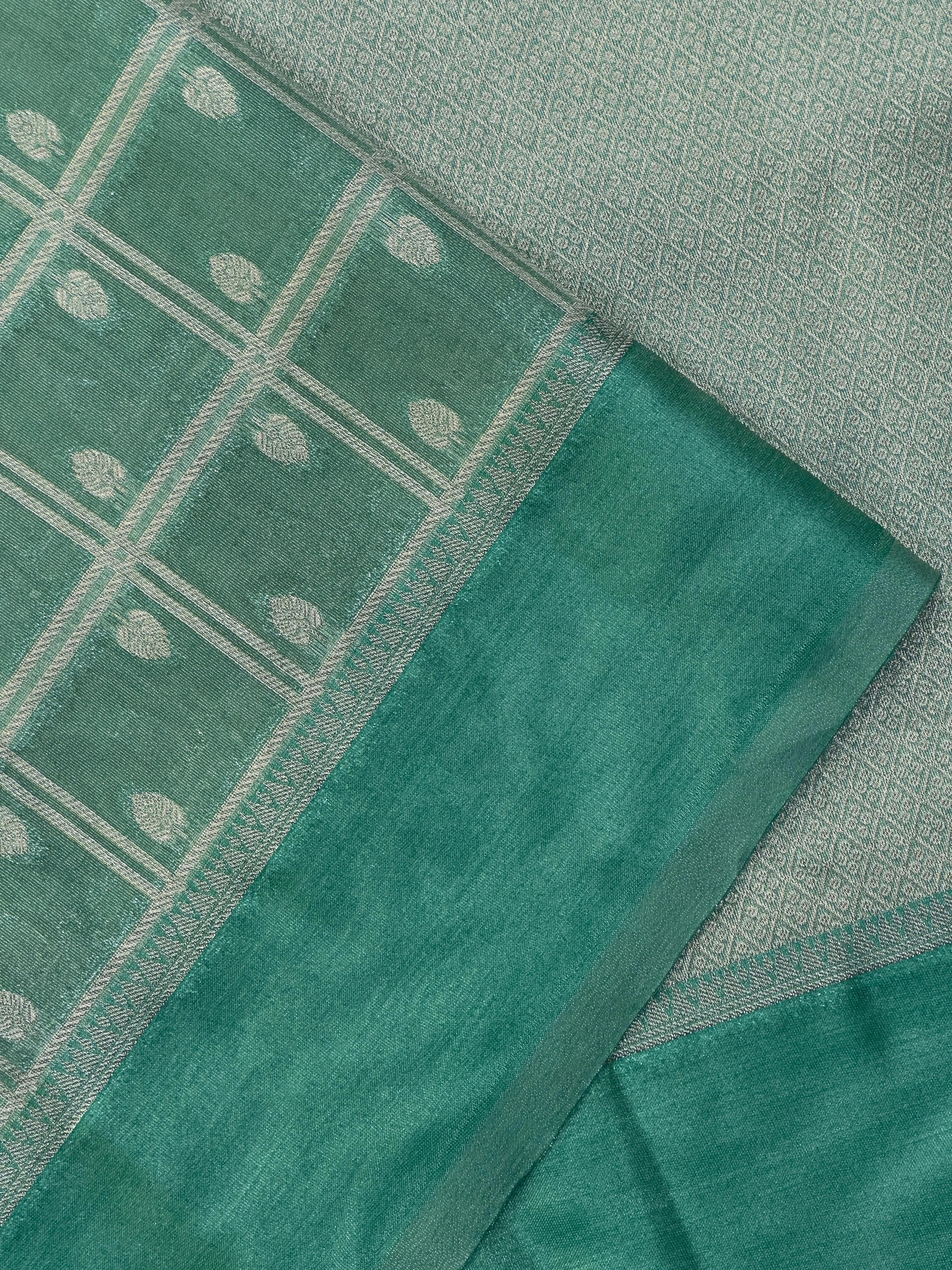 "Tissue Semi Banarasi Saree with intricate Banarasi motifs, made from lightweight, lustrous fabric. Perfect for weddings and festive occasions, offering elegant ethnic wear."