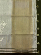 “Woman wearing a lightweight Tussar silk saree in earthy tones, featuring a soft natural sheen and subtle patterns—ideal for elegant daily wear.”