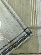 “Woman wearing a lightweight Tussar silk saree in earthy tones, featuring a soft natural sheen and subtle patterns—ideal for elegant daily wear.”