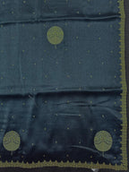 Woman draped in a Tussar Silk Saree with golden sheen and textured finish, ideal for ethnic events, poojas, and cultural functions.