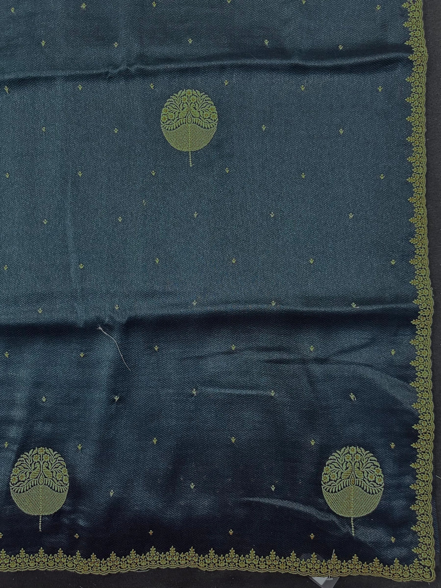 Woman draped in a Tussar Silk Saree with golden sheen and textured finish, ideal for ethnic events, poojas, and cultural functions.