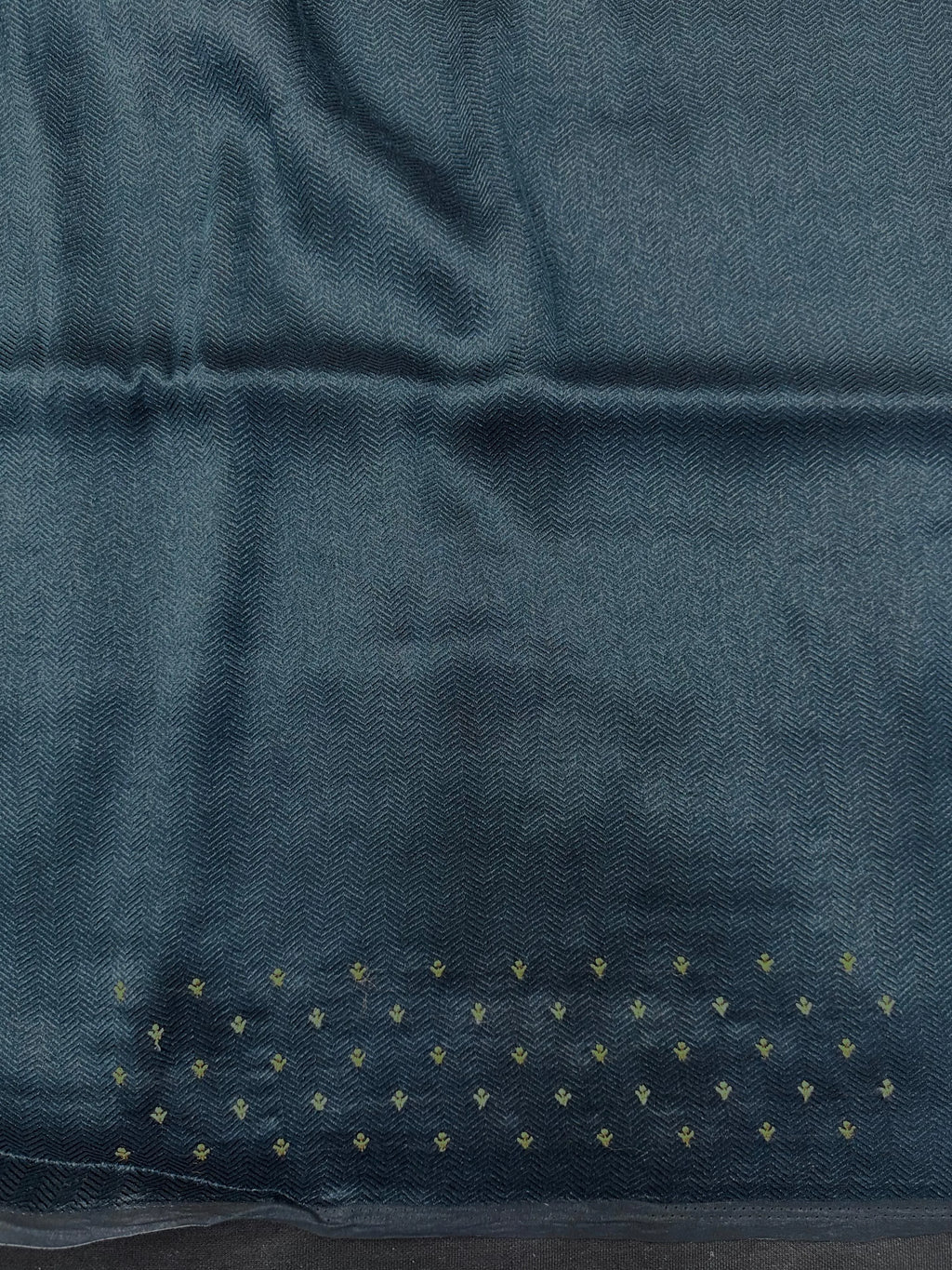 Woman draped in a Tussar Silk Saree with golden sheen and textured finish, ideal for ethnic events, poojas, and cultural functions.