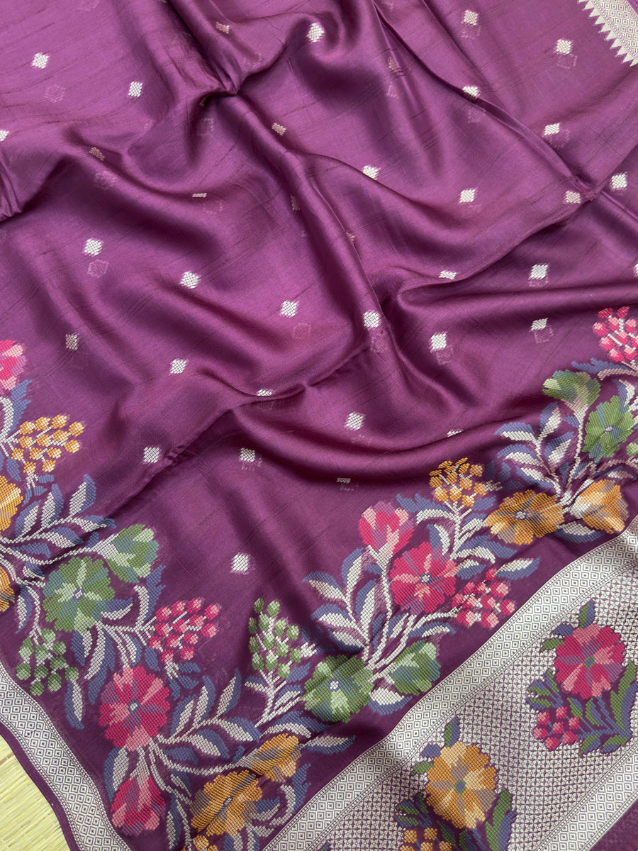 A graceful Tussar Silk Saree featuring rich texture and a natural sheen, designed for daily wear. The saree drapes elegantly, offering comfort and timeless beauty for everyday occasions.